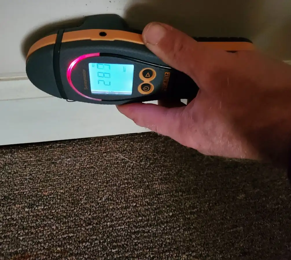 Moisture detection at baseboard during Burst Pipe Cleanup in Kendall West